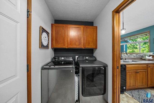 1413 Holbrook Ave, Sioux Falls, SD 57107 - laundry area with washer and clothes dryer and cabinet space