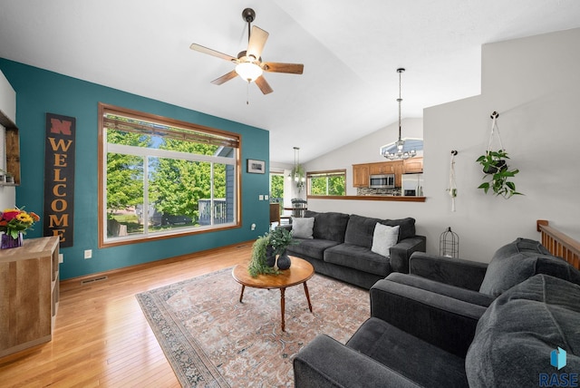 1413 Holbrook Ave, Sioux Falls, SD 57107 - living room with healthy amount of natural light, ceiling fan, light wood finished floors, and lofted ceiling