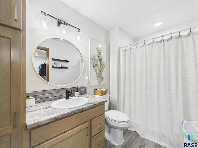 2560 E Meadowside Pl, Sioux Falls, SD 57108 - bathroom featuring vanity, wood finished floors, and a shower with shower curtain