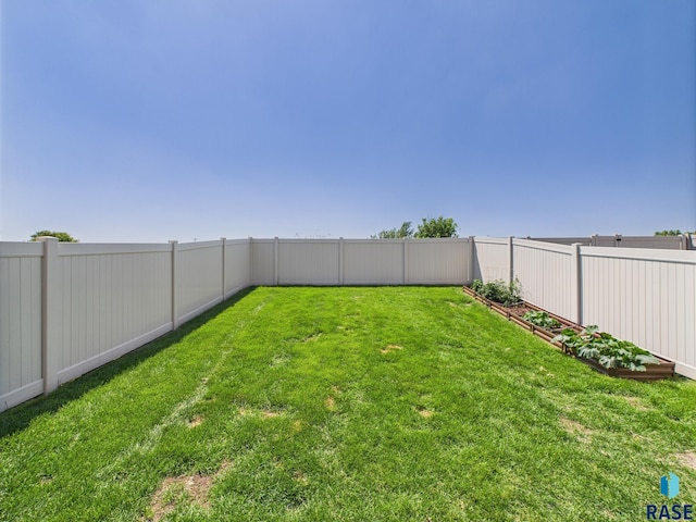 2560 E Meadowside Pl, Sioux Falls, SD 57108 - fenced backyard with a garden