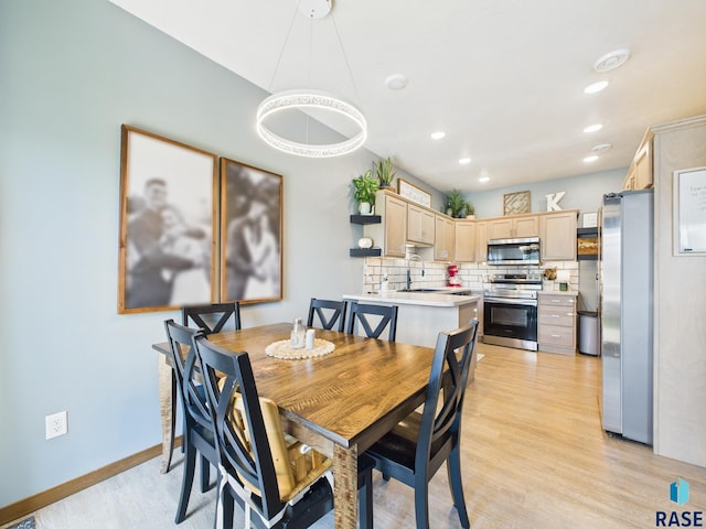 2560 E Meadowside Pl, Sioux Falls, SD 57108 - dining space featuring light wood-type flooring and recessed lighting