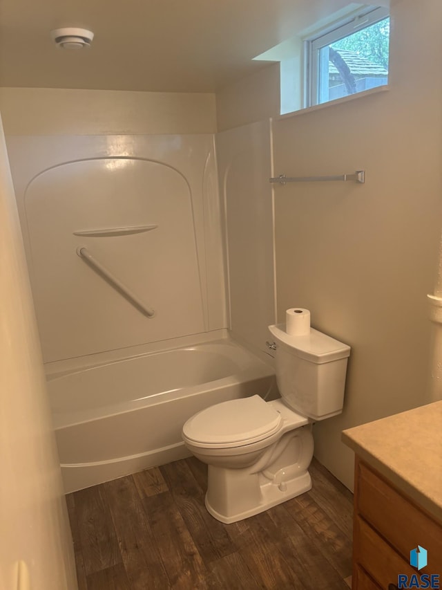 3605 E 12th St, Sioux Falls, SD 57103 - full bath with vanity, wood finished floors, and bathtub / shower combination