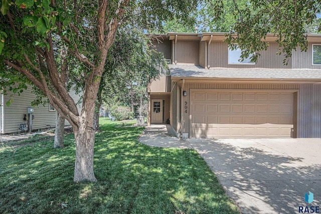 904 E Jane Ln, Sioux Falls, SD 57108 - view of front of property featuring concrete driveway, a garage, and a front lawn