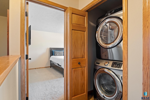 9232 W Norma Trl Unit 2, Sioux Falls, SD 57106 - laundry room with stacked washer / dryer and carpet floors
