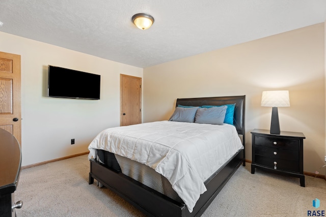 9232 W Norma Trl Unit 2, Sioux Falls, SD 57106 - bedroom featuring carpet and a textured ceiling