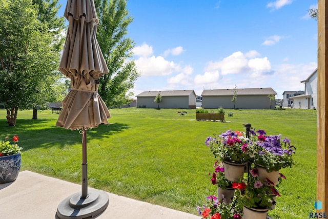 9232 W Norma Trl Unit 2, Sioux Falls, SD 57106 - view of green lawn with a patio area