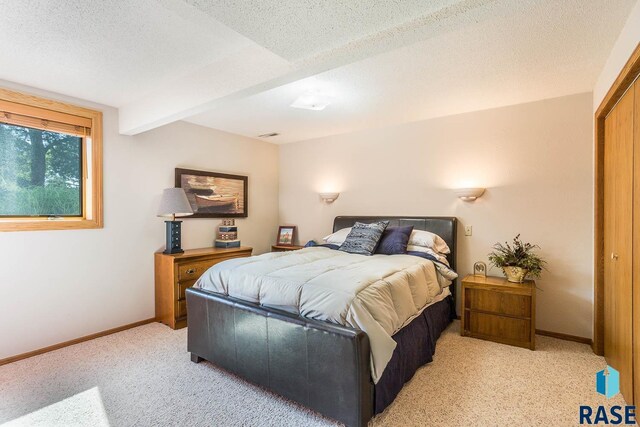 6500 E Split Rock Rd, Sioux Falls, SD 57110 - bedroom featuring light colored carpet, a textured ceiling, and beamed ceiling