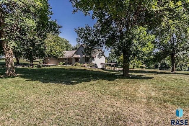 6500 E Split Rock Rd, Sioux Falls, SD 57110 - view of green lawn featuring an attached garage