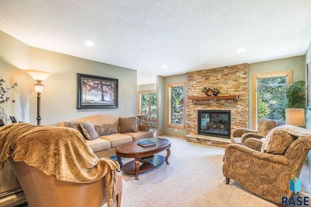 6500 E Split Rock Rd, Sioux Falls, SD 57110 - carpeted living area featuring healthy amount of natural light, a fireplace, and recessed lighting