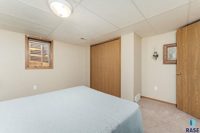 303 E 11th St, Dell Rapids, SD 57022 - carpeted bedroom with a drop ceiling and a closet
