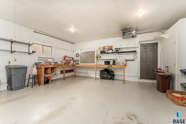 303 E 11th St, Dell Rapids, SD 57022 - garage with a workshop area and a heating unit