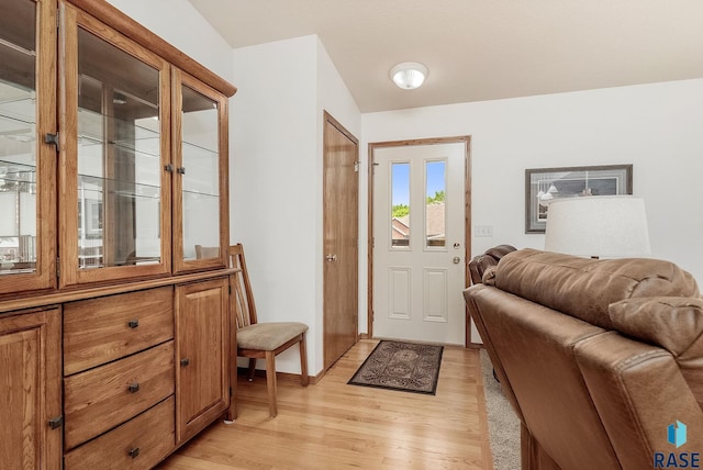 303 E 11th St, Dell Rapids, SD 57022 - foyer entrance with light wood finished floors and baseboards