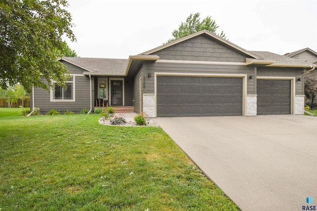 3208 S Triple Play Ave, Sioux Falls, SD 57110 - single story home featuring a garage, concrete driveway, and a front lawn