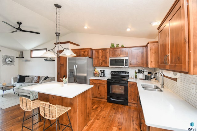 3208 S Triple Play Ave, Sioux Falls, SD 57110 - kitchen featuring stainless steel appliances, dark wood-style flooring, lofted ceiling, ceiling fan, and light countertops