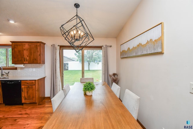 3208 S Triple Play Ave, Sioux Falls, SD 57110 - dining room with a chandelier and wood finished floors