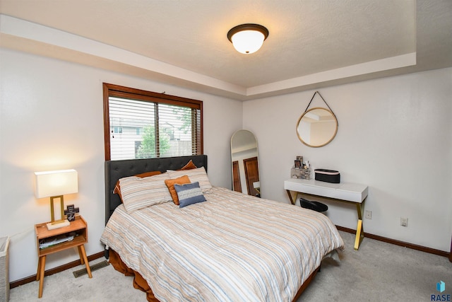 3208 S Triple Play Ave, Sioux Falls, SD 57110 - bedroom featuring light colored carpet and a tray ceiling