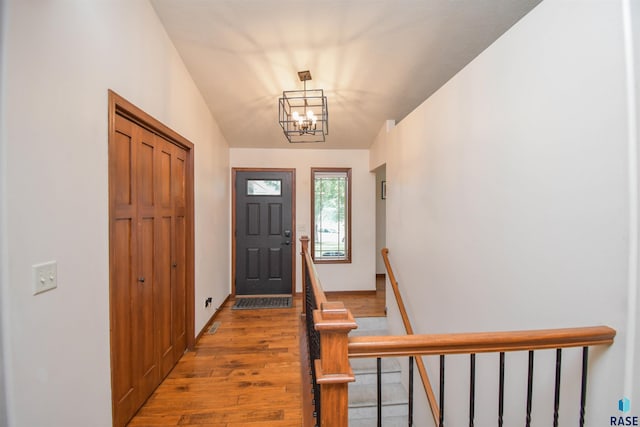 3208 S Triple Play Ave, Sioux Falls, SD 57110 - foyer with light wood-style flooring and a chandelier