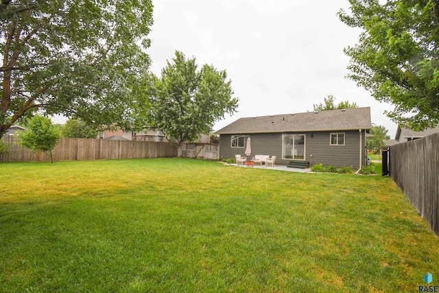 3208 S Triple Play Ave, Sioux Falls, SD 57110 - fenced backyard featuring a patio area and entry steps