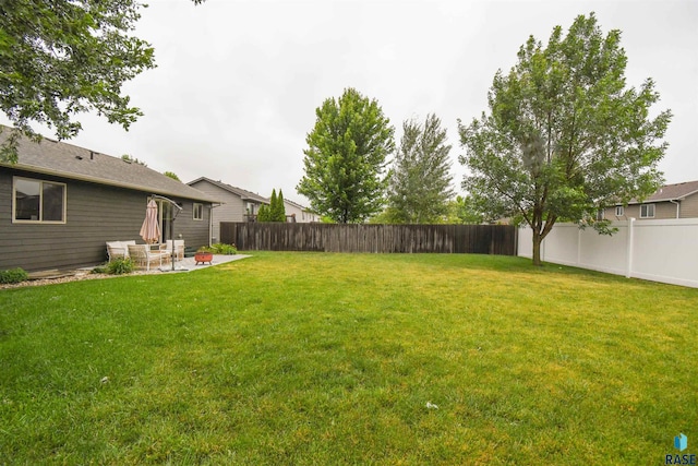 3208 S Triple Play Ave, Sioux Falls, SD 57110 - fenced backyard featuring a patio