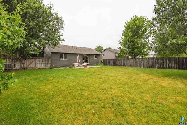 3208 S Triple Play Ave, Sioux Falls, SD 57110 - fenced backyard with a patio