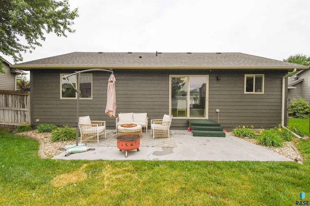 3208 S Triple Play Ave, Sioux Falls, SD 57110 - rear view of property with entry steps, a lawn, and a patio area
