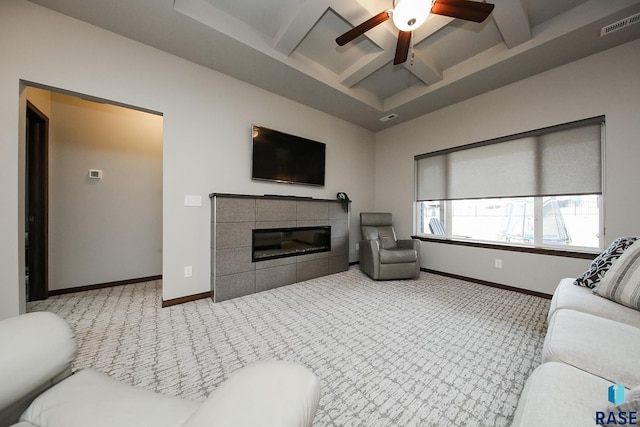 7905 S Brande Park Cir, Sioux Falls, SD 57108 - carpeted living room featuring a ceiling fan, beam ceiling, a tiled fireplace, and coffered ceiling