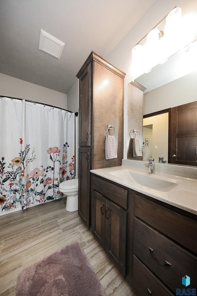 7905 S Brande Park Cir, Sioux Falls, SD 57108 - bathroom featuring vanity and wood finished floors