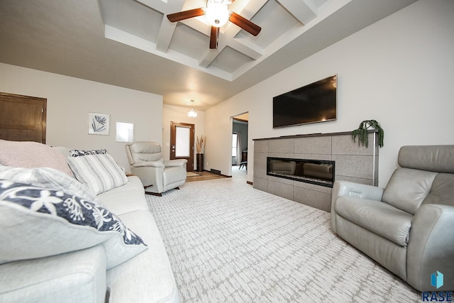 7905 S Brande Park Cir, Sioux Falls, SD 57108 - carpeted living area featuring a ceiling fan, beam ceiling, a tile fireplace, and coffered ceiling