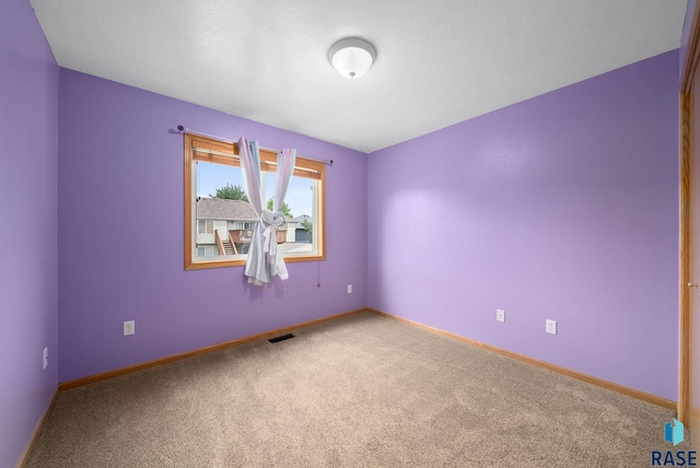 7020 W 53rd St, Sioux Falls, SD 57106 - carpeted empty room featuring baseboards