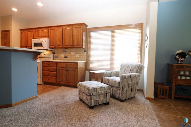 5708 S Shadow Wood Pl, Sioux Falls, SD 57108 - sitting room featuring tile patterned flooring, recessed lighting, and carpet flooring