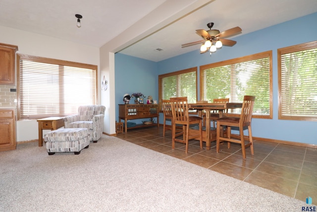 5708 S Shadow Wood Pl, Sioux Falls, SD 57108 - carpeted dining area featuring a ceiling fan and tile patterned floors