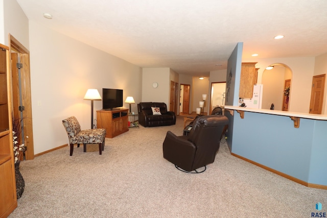 5708 S Shadow Wood Pl, Sioux Falls, SD 57108 - living room featuring carpet, arched walkways, and recessed lighting