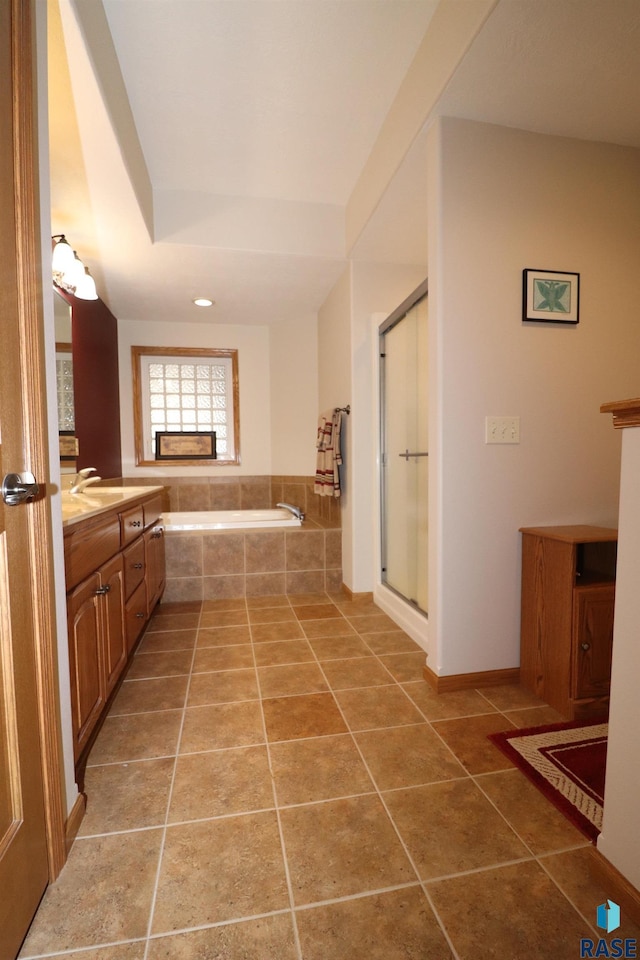 5708 S Shadow Wood Pl, Sioux Falls, SD 57108 - full bathroom featuring vanity, a garden tub, tile patterned flooring, and a stall shower