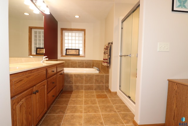 5708 S Shadow Wood Pl, Sioux Falls, SD 57108 - bathroom with a garden tub, a stall shower, double vanity, tile patterned floors, and recessed lighting