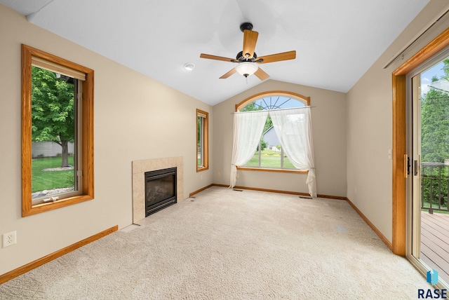 4912 E 42nd St, Sioux Falls, SD 57110 - unfurnished living room with carpet floors, a fireplace, lofted ceiling, and a ceiling fan