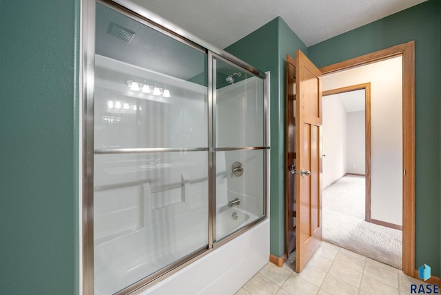 4912 E 42nd St, Sioux Falls, SD 57110 - full bathroom featuring combined bath / shower with glass door and tile patterned floors