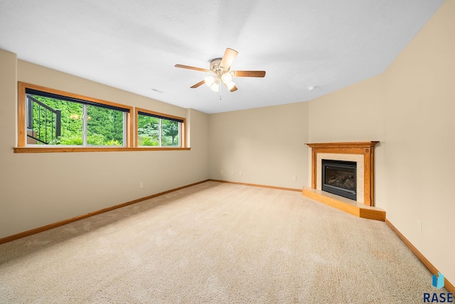4912 E 42nd St, Sioux Falls, SD 57110 - unfurnished living room with carpet, a ceiling fan, and a high end fireplace