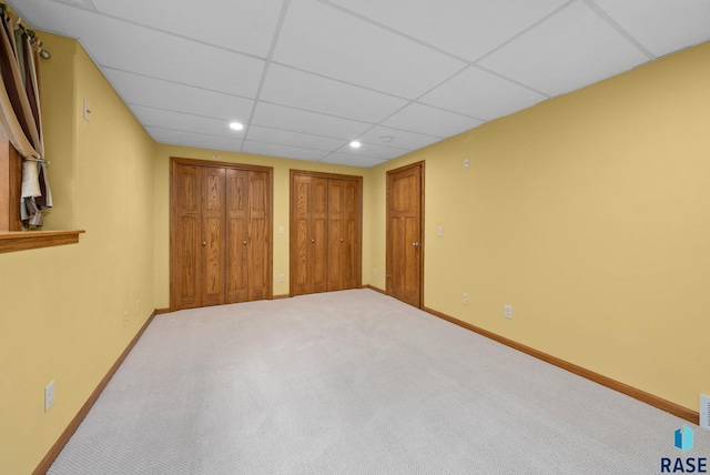 4912 E 42nd St, Sioux Falls, SD 57110 - unfurnished bedroom with two closets, carpet, a paneled ceiling, and recessed lighting