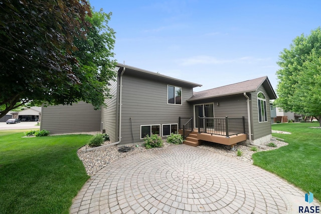 4912 E 42nd St, Sioux Falls, SD 57110 - back of house with a patio area, a deck, and a yard