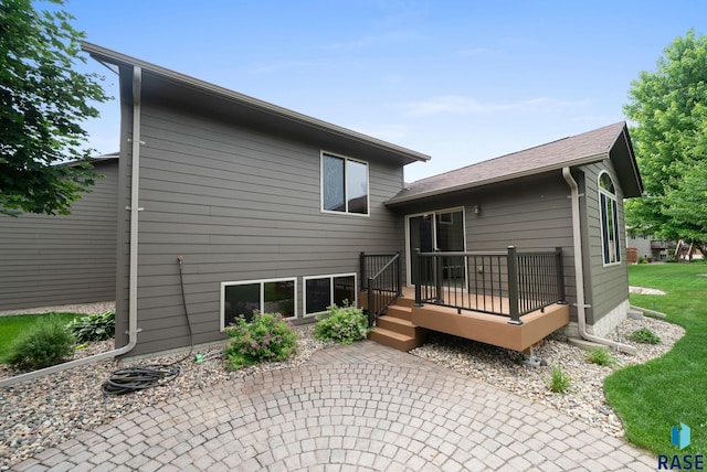 4912 E 42nd St, Sioux Falls, SD 57110 - back of property featuring a deck and a patio