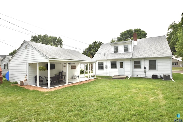 1620 S W Ave, Sioux Falls, SD 57105 - back of house with a chimney, a yard, and roof with shingles