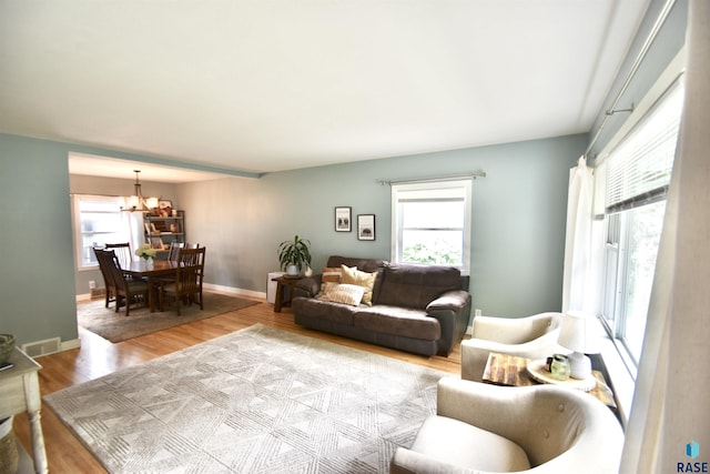 1620 S W Ave, Sioux Falls, SD 57105 - living room with a chandelier, plenty of natural light, and wood finished floors