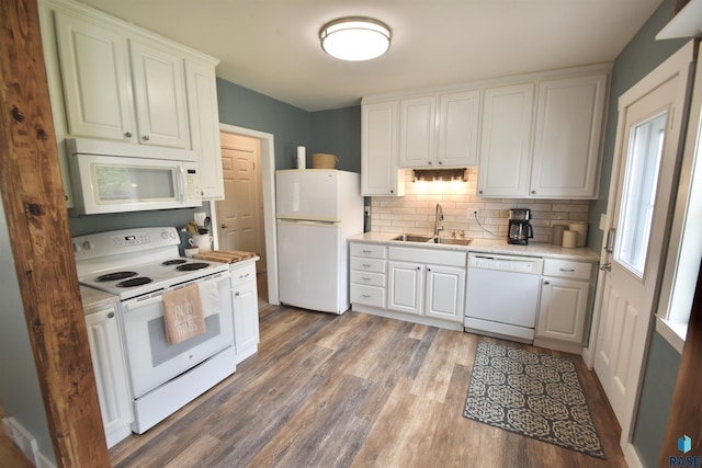 1620 S W Ave, Sioux Falls, SD 57105 - kitchen featuring white appliances, light countertops, wood finished floors, white cabinets, and tasteful backsplash