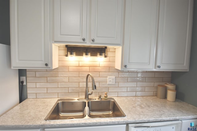 1620 S W Ave, Sioux Falls, SD 57105 - kitchen with light countertops, white cabinetry, and tasteful backsplash