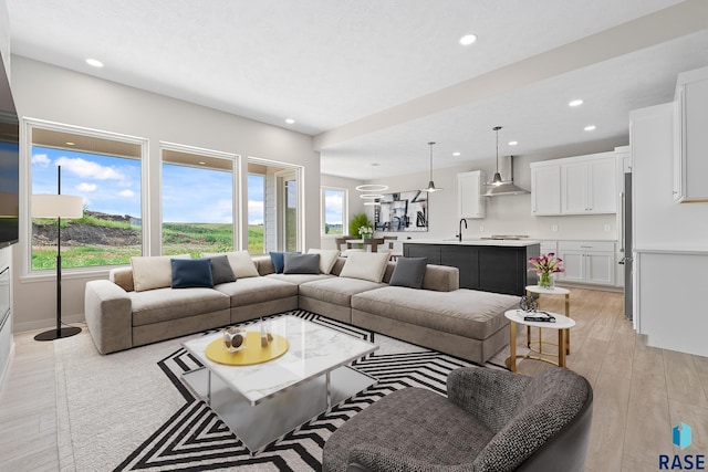 501 N Wildcat Dr, Sioux Falls, SD 57110 - living area with healthy amount of natural light, recessed lighting, and light wood-style flooring