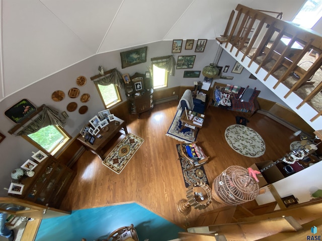 1496 121st St, Luverne, MN 56156 - living room with wood finished floors, stairway, and a baseboard radiator