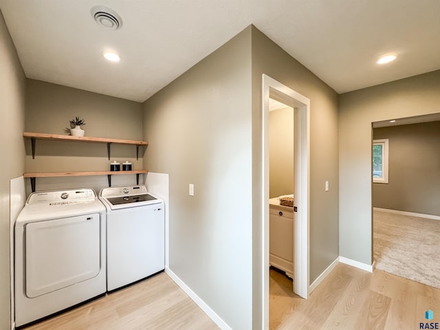 340 N Juniper Ave, Parker, SD 57053 - laundry area featuring washer and clothes dryer, light wood finished floors, and recessed lighting