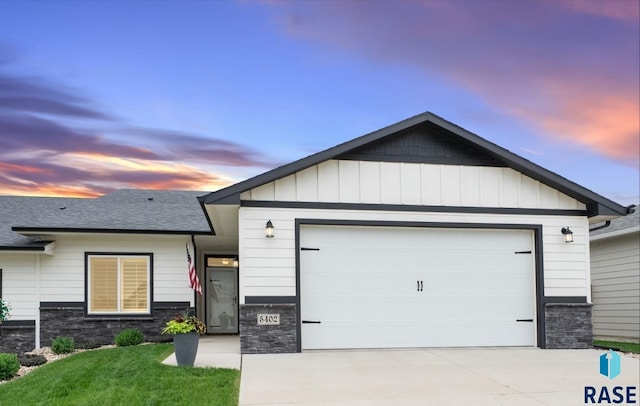 5402 S Bahnson Ave, Sioux Falls, SD 57108 - ranch-style home with stone siding, driveway, and a garage