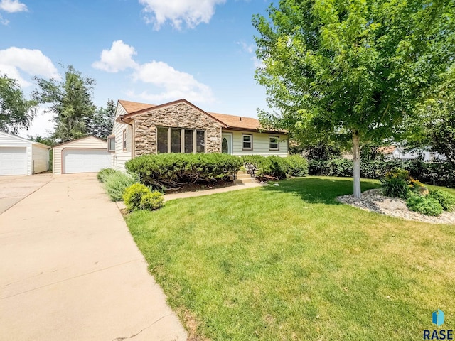 3112 E 15th St, Sioux Falls, SD 57103 - single story home featuring stone siding, a detached garage, an outbuilding, and a front yard