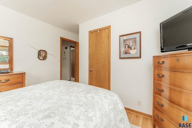 3112 E 15th St, Sioux Falls, SD 57103 - bedroom featuring wood finished floors and a closet